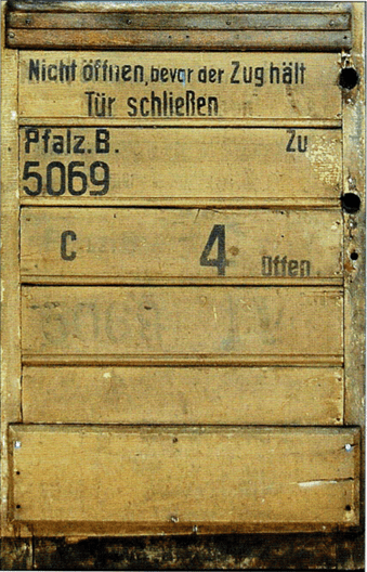 The inside of one of 5069's doors. This is for compartment C; the 4 denotes class (D type/ IV. Classe stock). The German text reads "Do not open the door before the train stops. Close Door. Photo credit: Maier & Mandrys